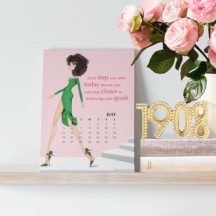Pink and Green Expressions Calendar with a stylish woman and motivational quote, next to pink roses and a pearl '1908' display.