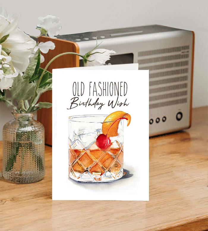 Birthday greeting card featuring an old-fashioned drink and 'Old Fashioned Birthday Wish' text
