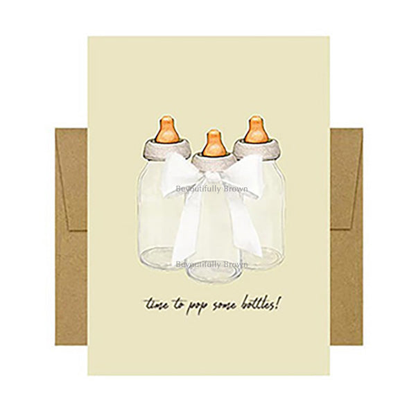 Fun greeting card with baby bottle illustrations and text 'time to pop some bottles!' on the cover