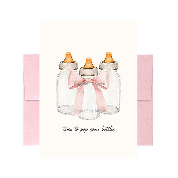 Greeting card with illustration of baby bottles with pink ribbons and the text 'time to pop some bottles!' from Beyoutifully Brown