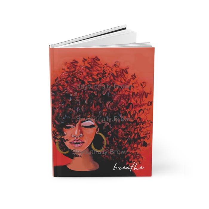 Journal notebook with a design of a woman exhaling and the word 'Breathe' on the cover