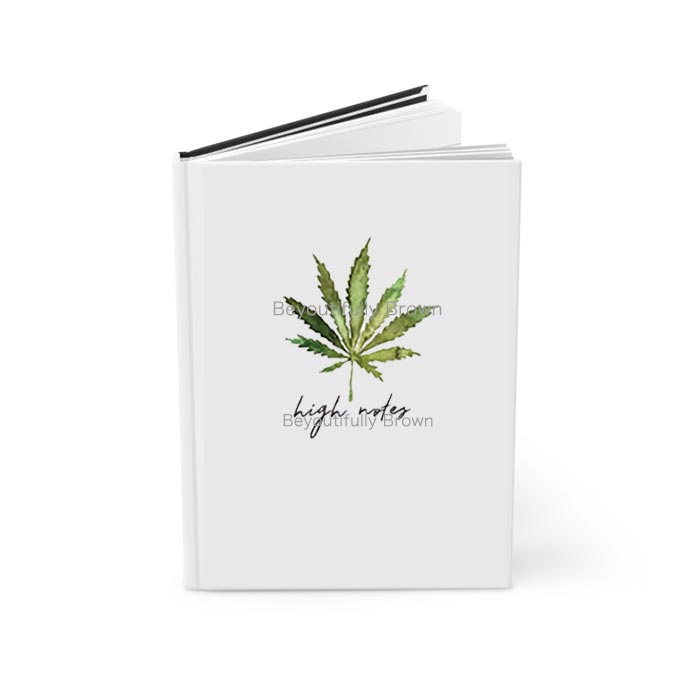 Journal notebook with a cannabis leaf design and 'high notes' text on the cover