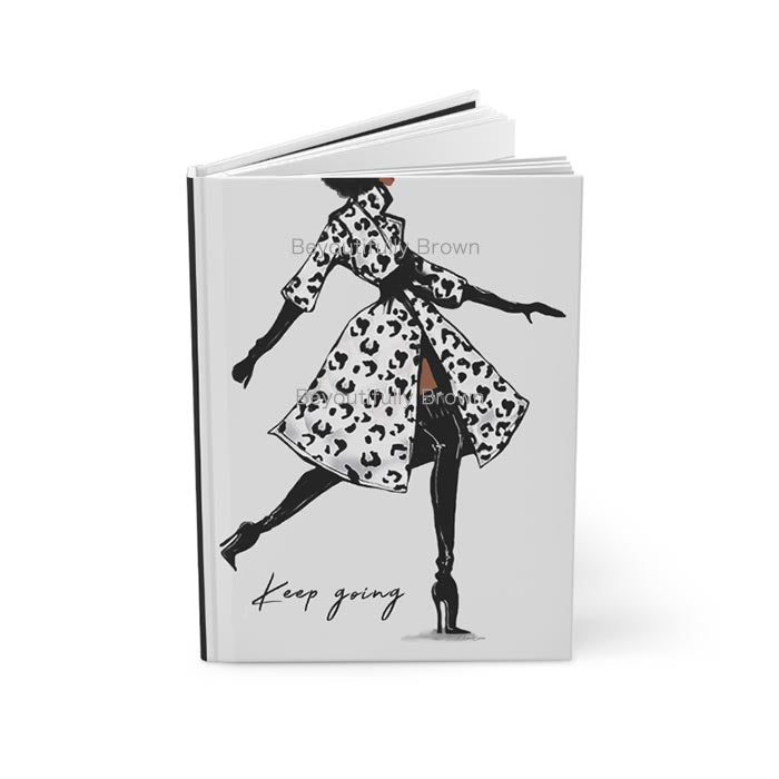 Journal Notebook with illustration of a woman walking and 'Keep going' text on the cover