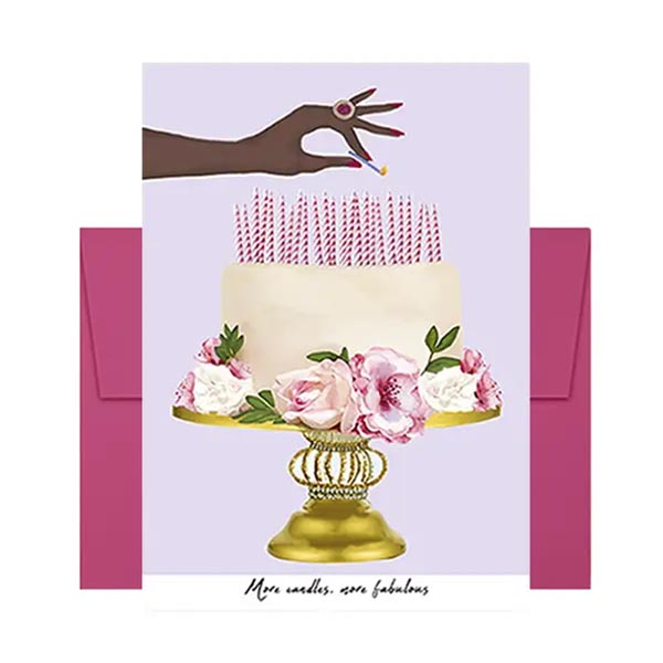Greeting card with a hand holding a lit candle above a decorated cake on a purple background.