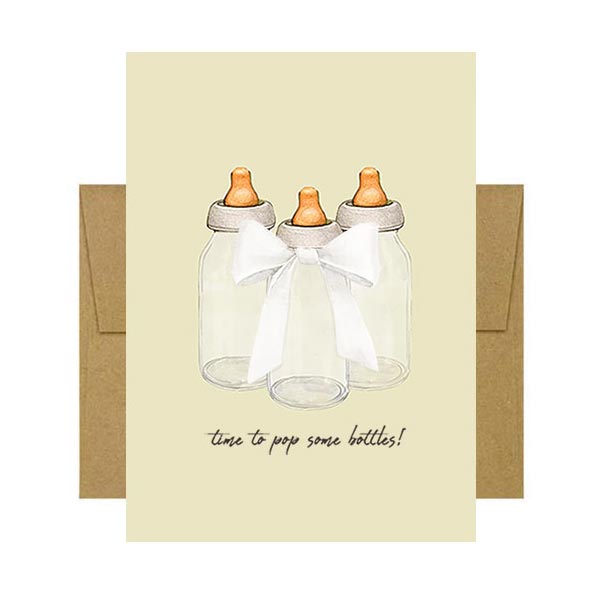 Fun greeting card with baby bottle illustrations and text 'time to pop some bottles!' on the cover