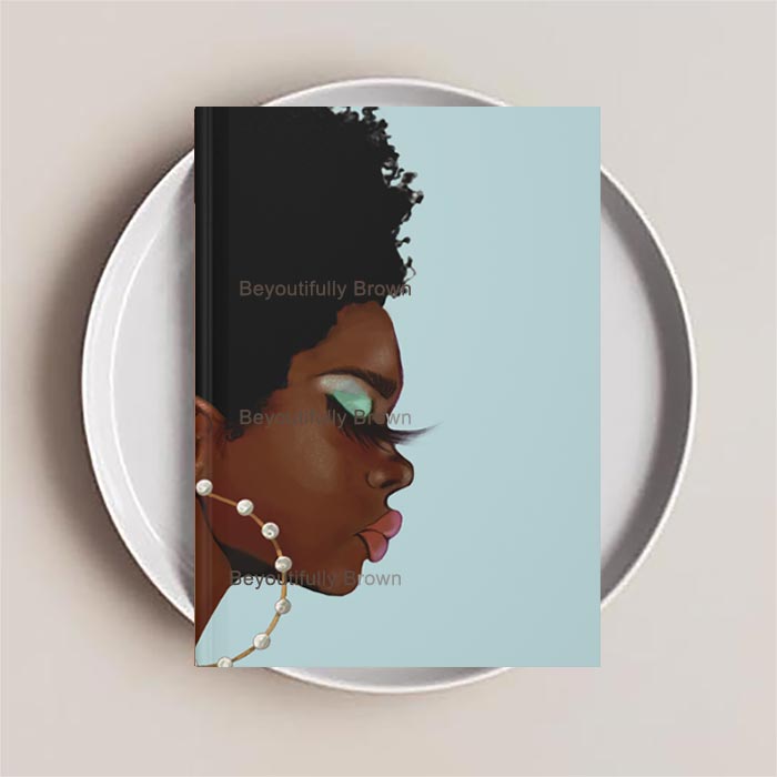Journal Notebook with an illustration of a woman's profile on the cover