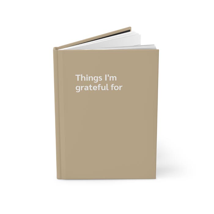 Journal notebook with 'Things I'm grateful for' text on the cover