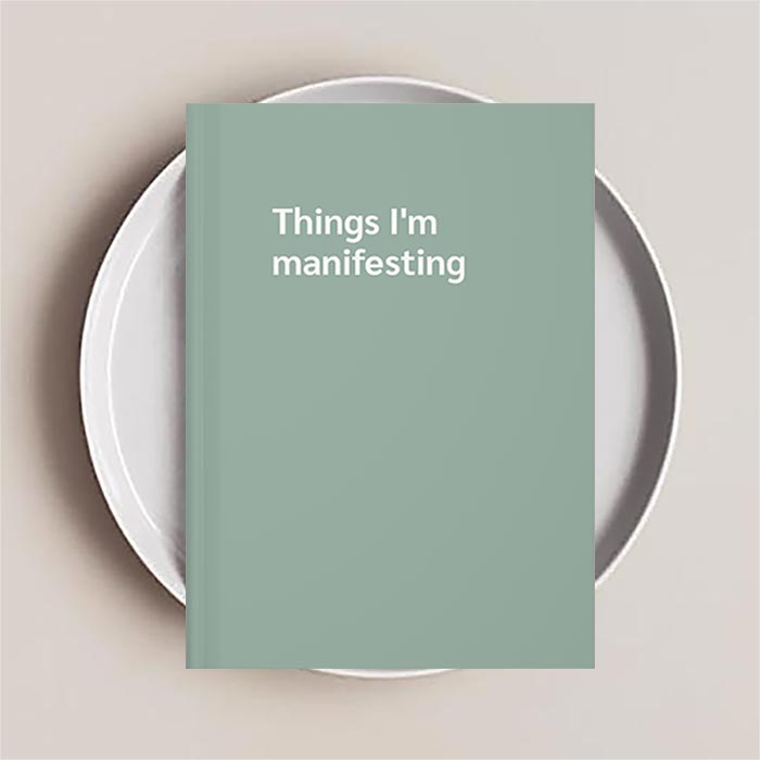 Journal notebook that reads 'Things I'm manifesting' on the cover