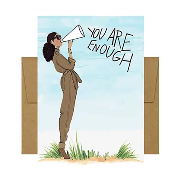 Greeting card with illustration of a woman holding a megaphone and 'YOU ARE ENOUGH' text, with a brown envelope.