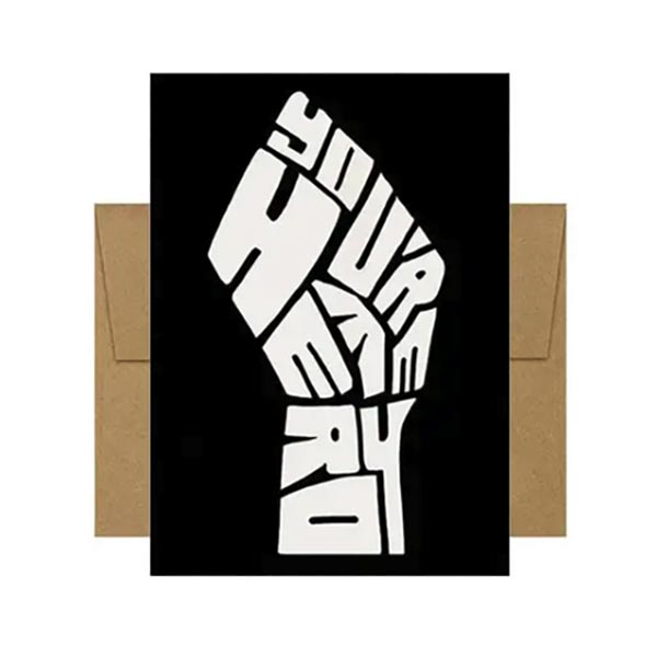Greeting card with a fist graphic with the words you're my hero on a black background